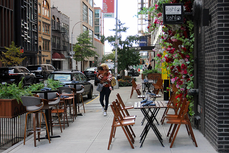 Some open restaurants only left a meter width for pedestrians to pass